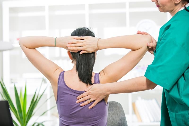 Chiropractor performing a hands-on adjustment for back pain relief