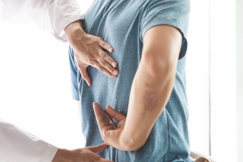 Suggested Alt Text: Patient receiving a chiropractic back adjustment at Bolt Chiropractic Family Wellness in Oxnard
